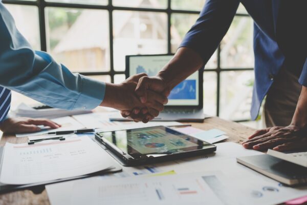 Young Businessman And Financial Representative Shaking Hands