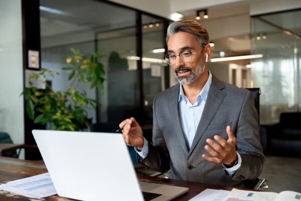 Man Using Computer Remote For Business